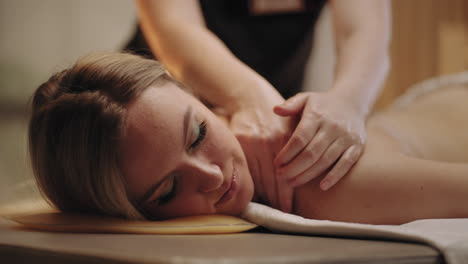beauty-and-relax-day-in-spa-salon-young-woman-is-enjoying-professional-massage-physician-is-massaging-back